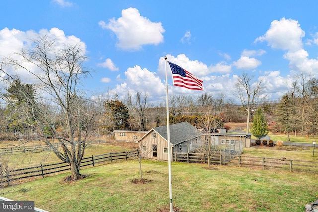 view of yard with a rural view