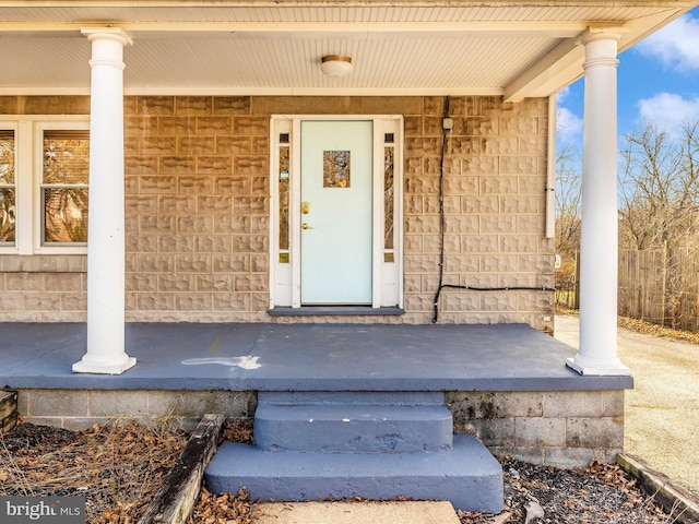 entrance to property featuring covered porch