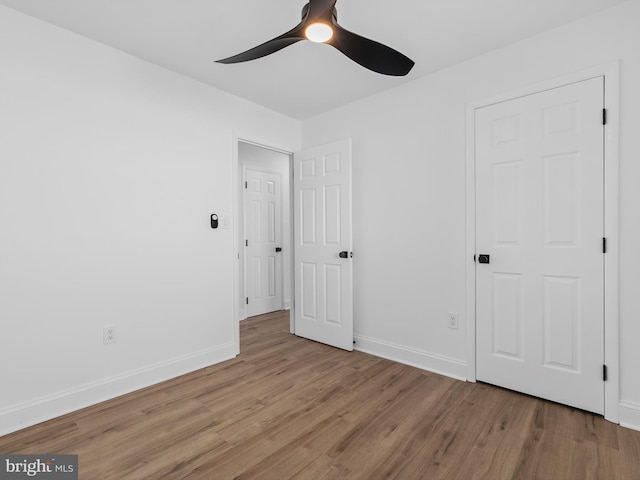 unfurnished bedroom featuring light hardwood / wood-style flooring and ceiling fan