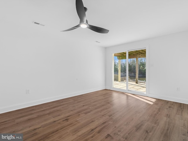 empty room featuring hardwood / wood-style floors and ceiling fan