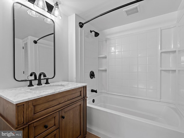 bathroom featuring vanity and shower / washtub combination