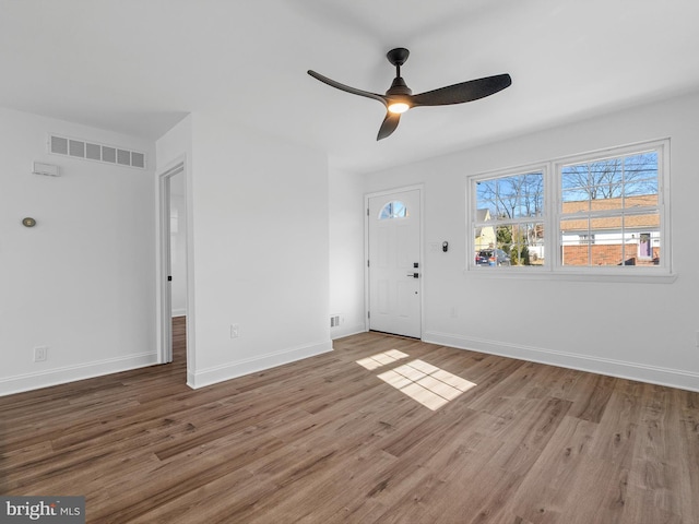 foyer with hardwood / wood-style flooring and ceiling fan