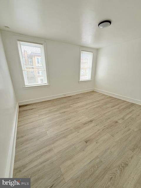 empty room with light wood-type flooring