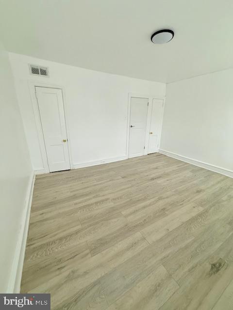 unfurnished room featuring light wood-type flooring