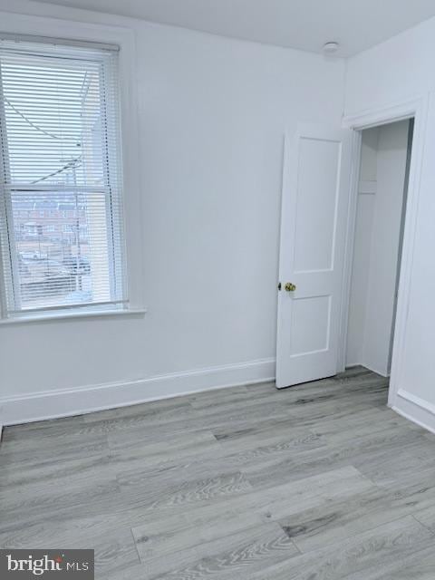 spare room featuring light hardwood / wood-style floors