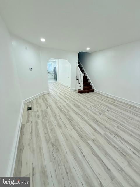 basement with light hardwood / wood-style floors