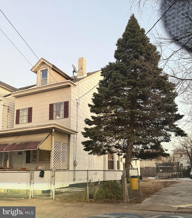 view of side of property with a trampoline