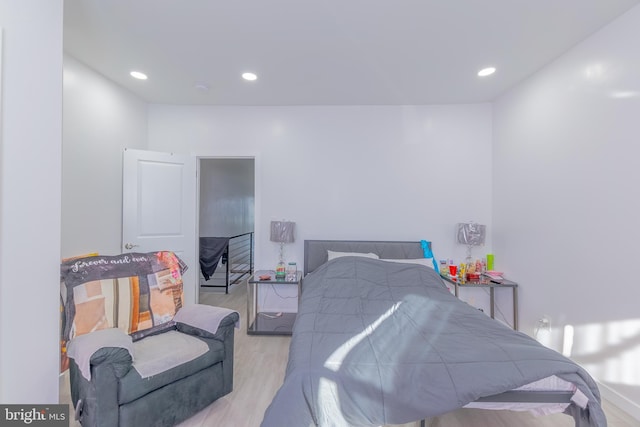 bedroom with light hardwood / wood-style flooring