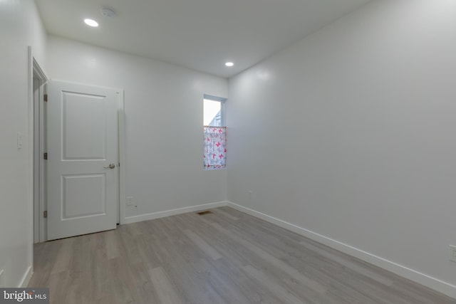 unfurnished room featuring light wood-type flooring