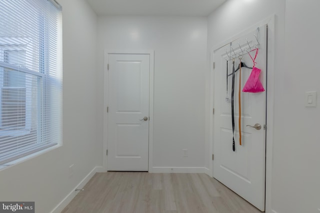 corridor featuring light hardwood / wood-style floors