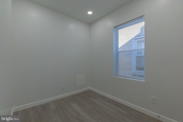 unfurnished room featuring wood-type flooring