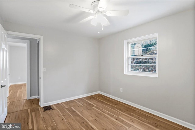 spare room with ceiling fan and light hardwood / wood-style floors