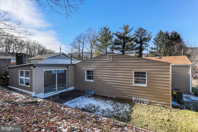 rear view of property featuring central air condition unit