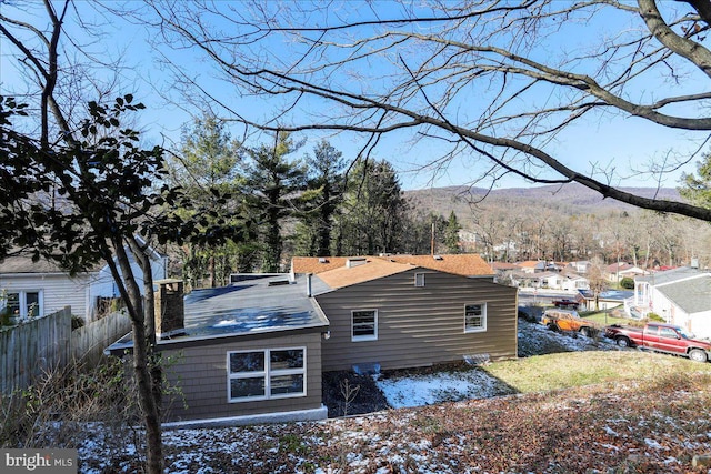 back of house with a mountain view