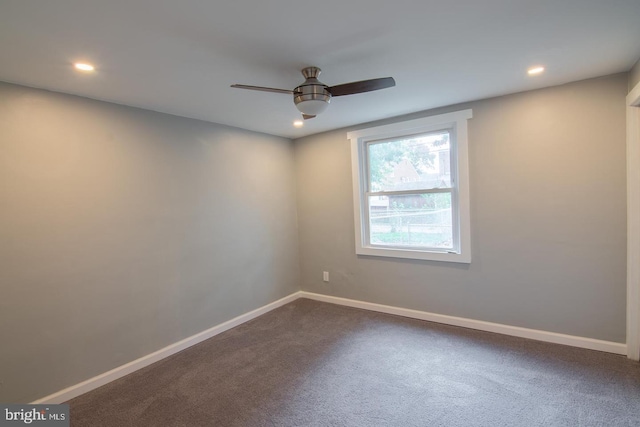 carpeted empty room featuring ceiling fan