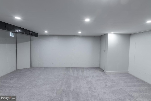 basement with light colored carpet