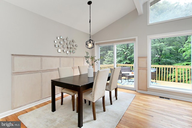 5284 Davis Ford Rd, Woodbridge, VA 22192 - dining room with light wood-type flooring, high vaulted ceiling, and a chandelier