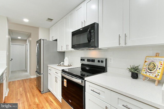 5284 Davis Ford Rd, Woodbridge, VA 22192 - kitchen with appliances with stainless steel finishes, light countertops, white cabinetry, and recessed lighting
