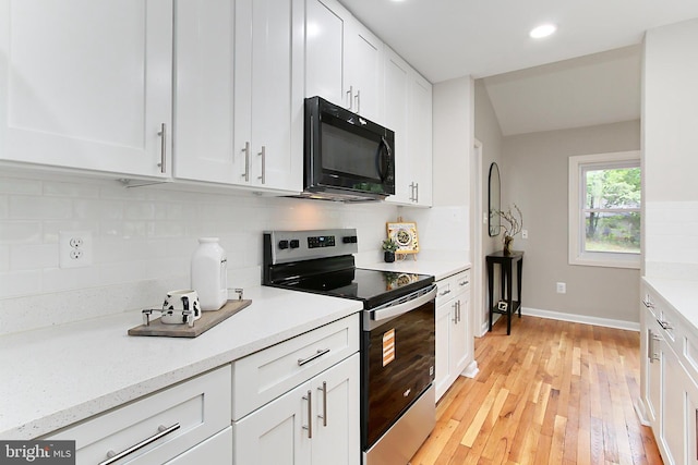 5284 Davis Ford Rd, Woodbridge, VA 22192 - kitchen with electric stove, black microwave, light countertops, white cabinetry, and recessed lighting