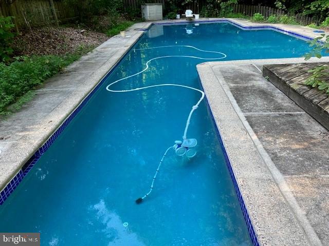 5284 Davis Ford Rd, Woodbridge, VA 22192 - view of pool featuring a fenced backyard and a diving board