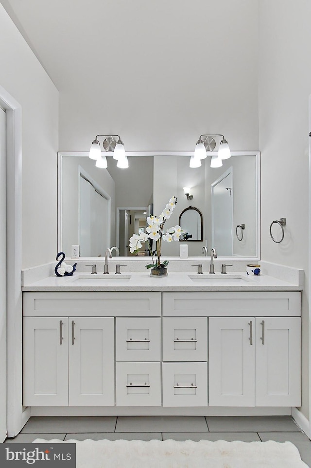 5284 Davis Ford Rd, Woodbridge, VA 22192 - full bathroom with double vanity and tile patterned flooring