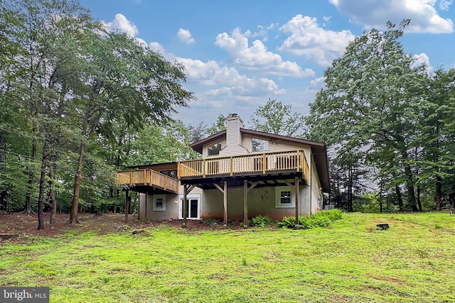5284 Davis Ford Rd, Woodbridge, VA 22192 - back of property with a deck, a lawn, a chimney, and stucco siding