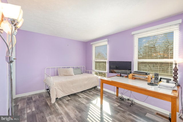 bedroom with wood-type flooring