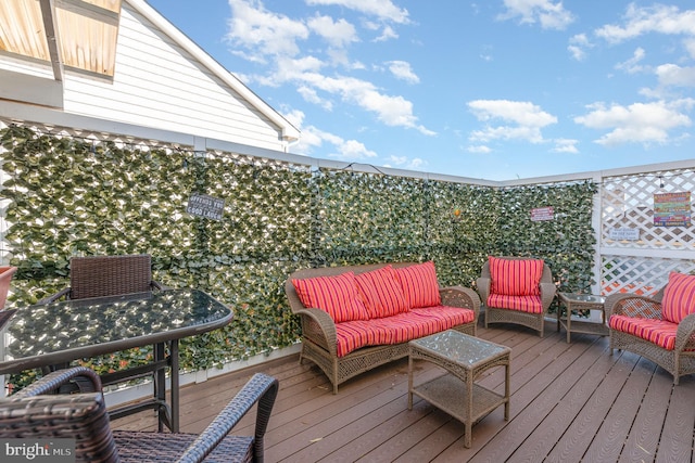 wooden deck featuring an outdoor hangout area