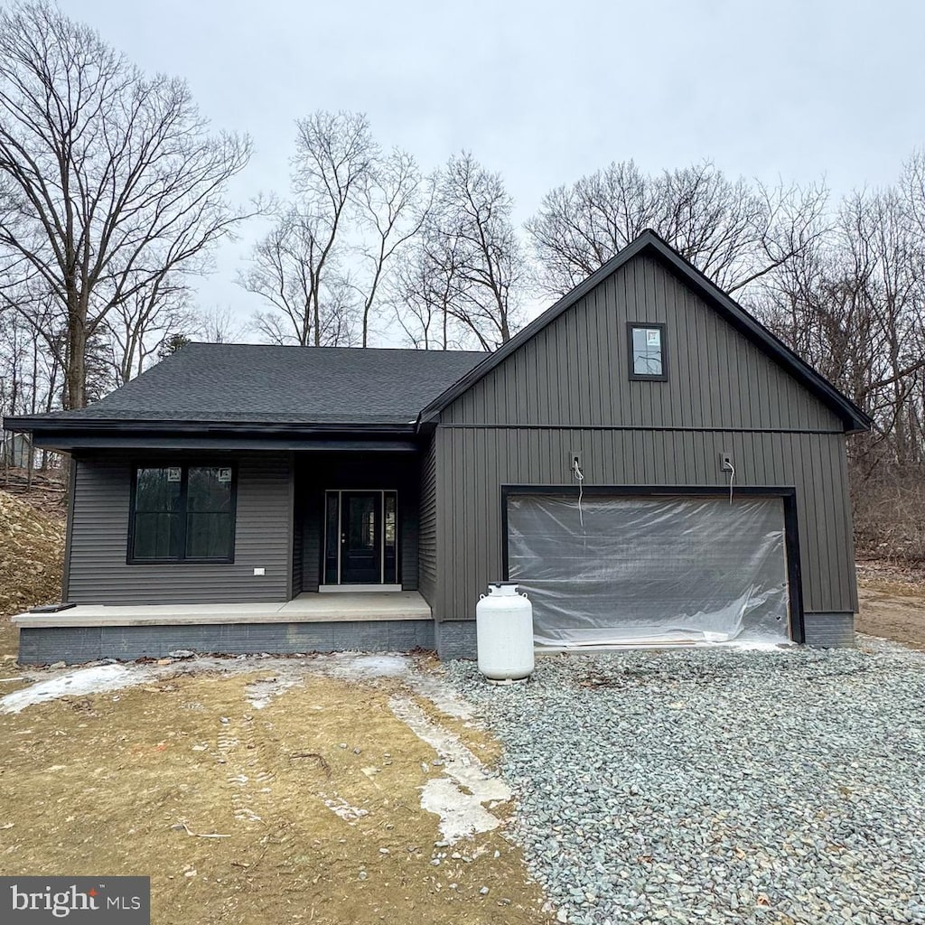 view of front of house featuring a garage and a porch