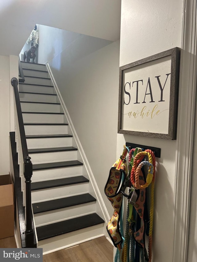 stairway with wood-type flooring