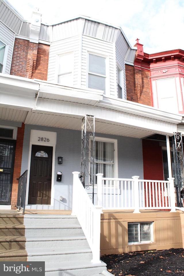 entrance to property with a porch