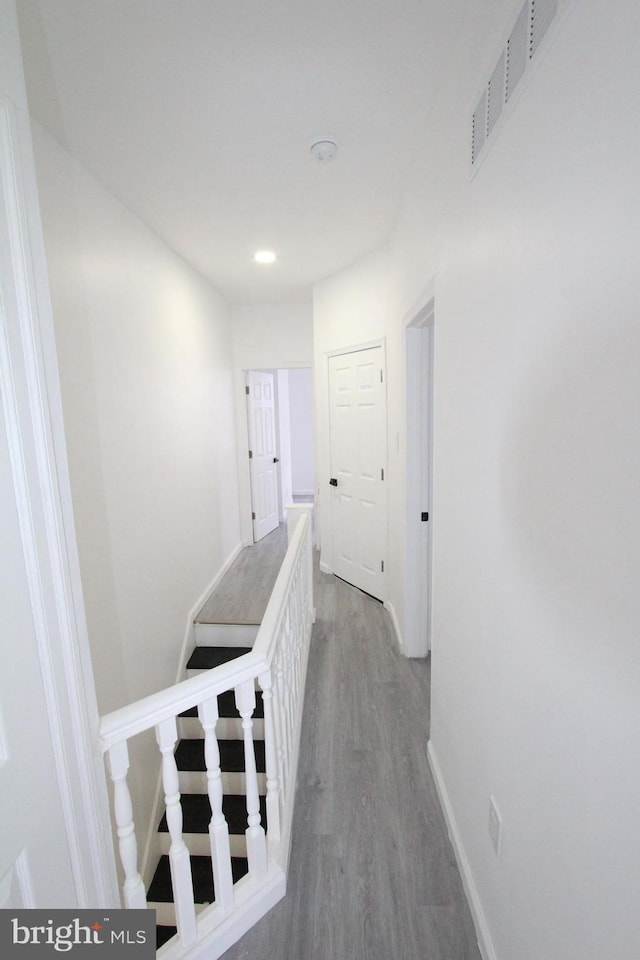 corridor featuring wood-type flooring