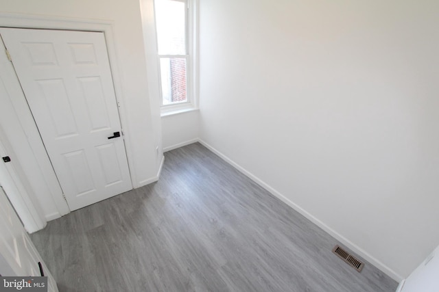 spare room featuring light hardwood / wood-style flooring