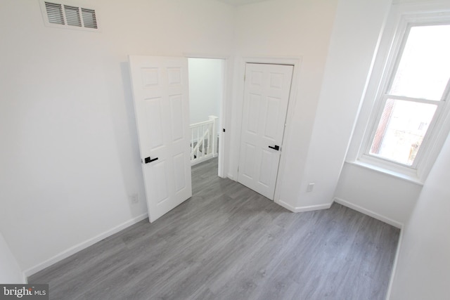 spare room featuring light hardwood / wood-style floors