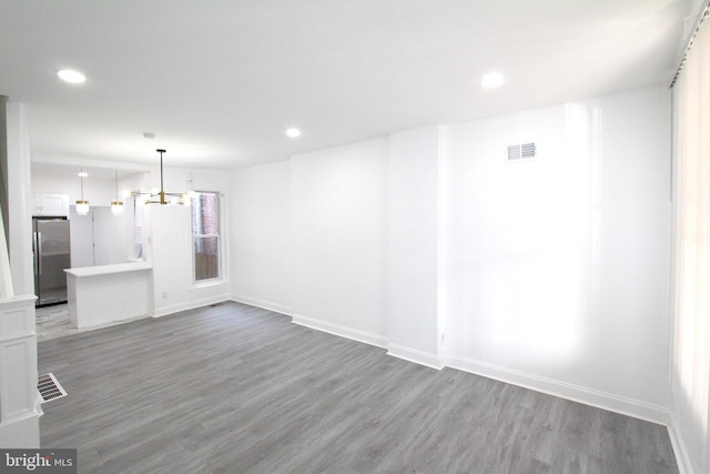 interior space featuring a chandelier and hardwood / wood-style floors