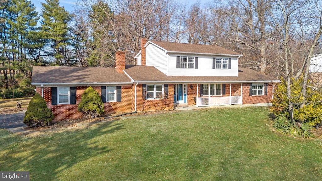 front facade featuring a front yard and a porch