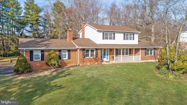 front facade featuring a front yard and a porch