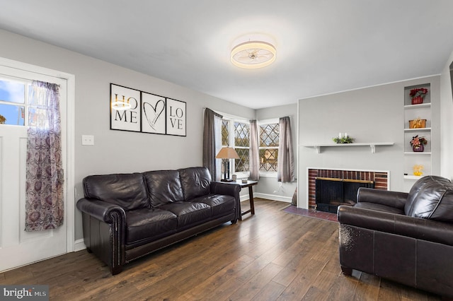 living room featuring a fireplace and dark hardwood / wood-style floors