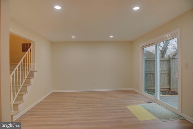 spare room with light hardwood / wood-style floors