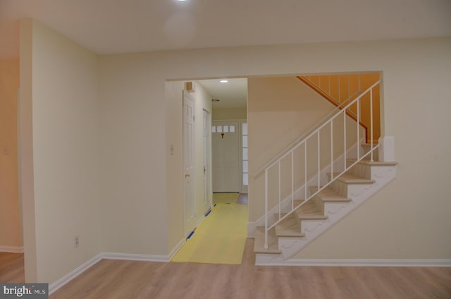 stairway featuring hardwood / wood-style flooring