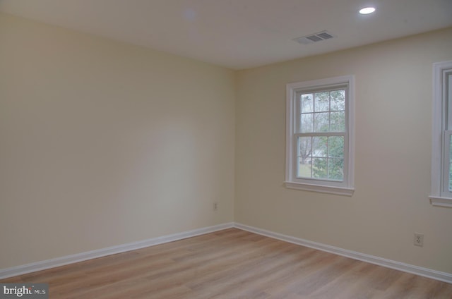 spare room with light wood-type flooring