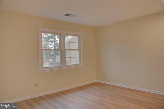 empty room with light wood-type flooring