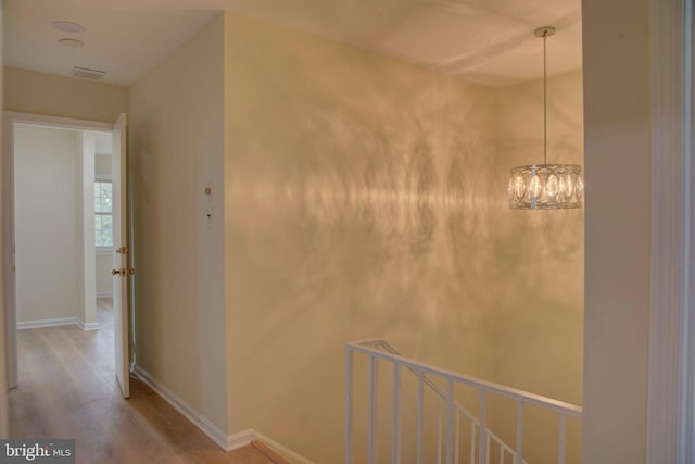 corridor featuring hardwood / wood-style floors