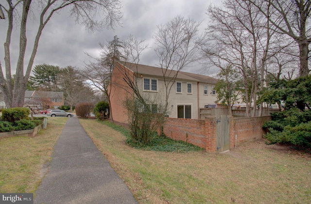 view of home's exterior featuring a lawn