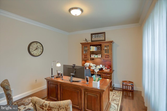 home office with dark hardwood / wood-style flooring and ornamental molding