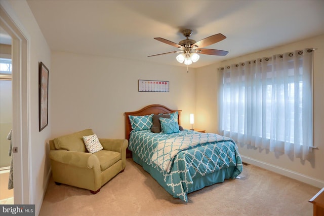 bedroom with multiple windows, carpet flooring, and ceiling fan