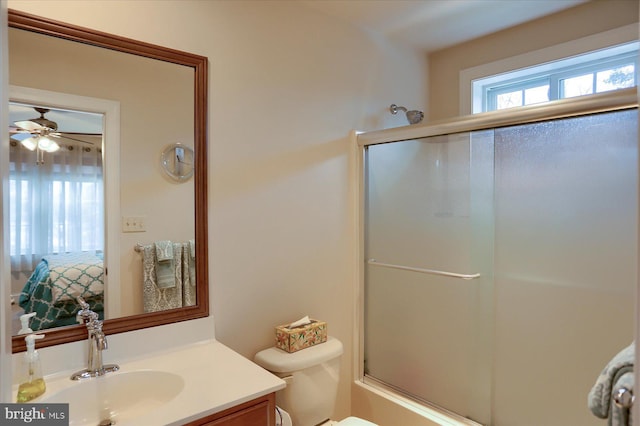 full bathroom with vanity, toilet, and shower / bath combination with glass door