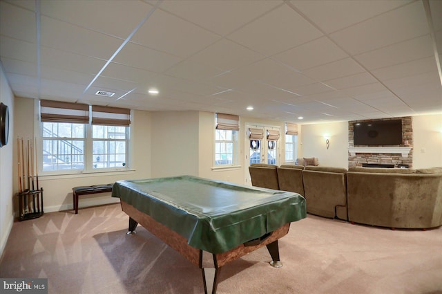 playroom featuring a fireplace, light colored carpet, a drop ceiling, and billiards