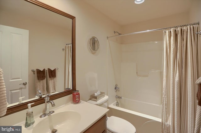 full bathroom with vanity, shower / bathtub combination with curtain, and toilet