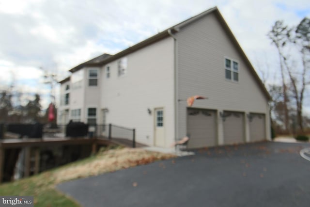 view of property exterior featuring a garage